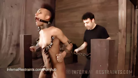 The bound black woman fucked up from whipping with a whip and fucking with a stick in her pussy