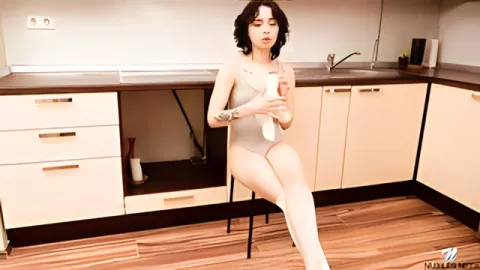 Horny brunette in the kitchen serves her pussy hot