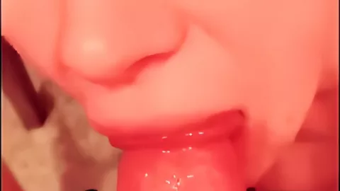 Pretty woman sucks a huge dick soaked in wine from under the table