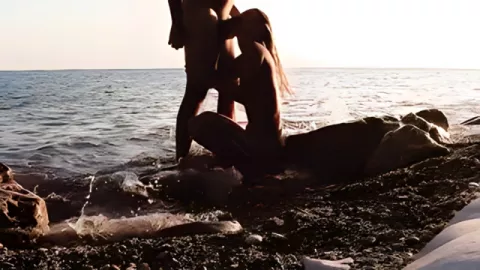 A Russian man fucks a sexy girlfriend with doggy style on a rocky seashore