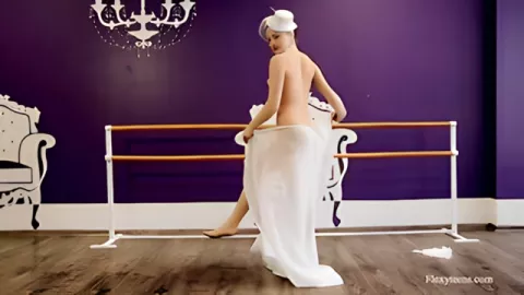 Show of an artistic ballerina in a dress with a display of tits and pussy