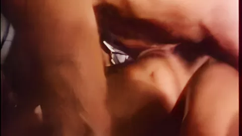 Roasting a hairy woman rubbed with fingers on the couch in retro porn
